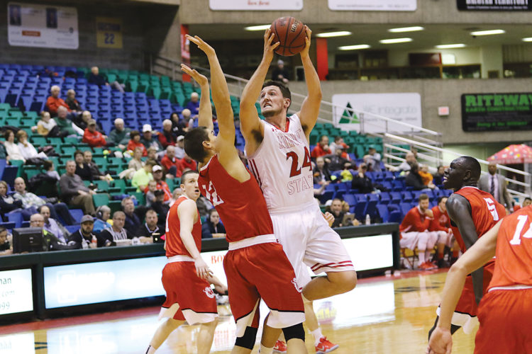 Sean Arbaut/Minot State athletics Minot State's Tyler Rudolph (24) initiates contact at the basket during a men's college basketball game on Friday at the MSU Dome in Minot.